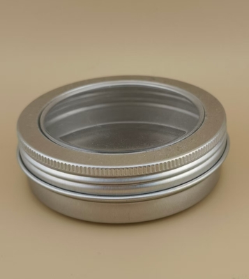 Grote zilverkleurige aluminium behuizing met doorzichtige schroefdop voor cosmetica