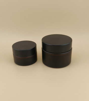Mooi ontworpen zwarte glazen crème pot met schroefdeksel voor lotion