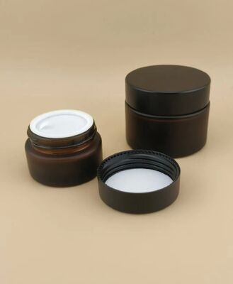 Mooi ontworpen zwarte glazen crème pot met schroefdeksel voor lotion