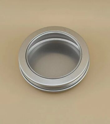 Grote zilverkleurige aluminium behuizing met doorzichtige schroefdop voor cosmetica