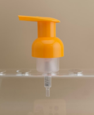 Delicaat ontworpen oranje plastic schuimpomp voor shampooflessen