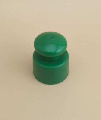 Groene plastic gladde dop met knop voor cosmetische flessen