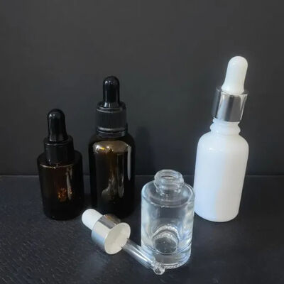 Hoge kwaliteit leverancier Amber Clear Boston 2oz glazen etherische oliefles met druppelaar 60ml voor serum
